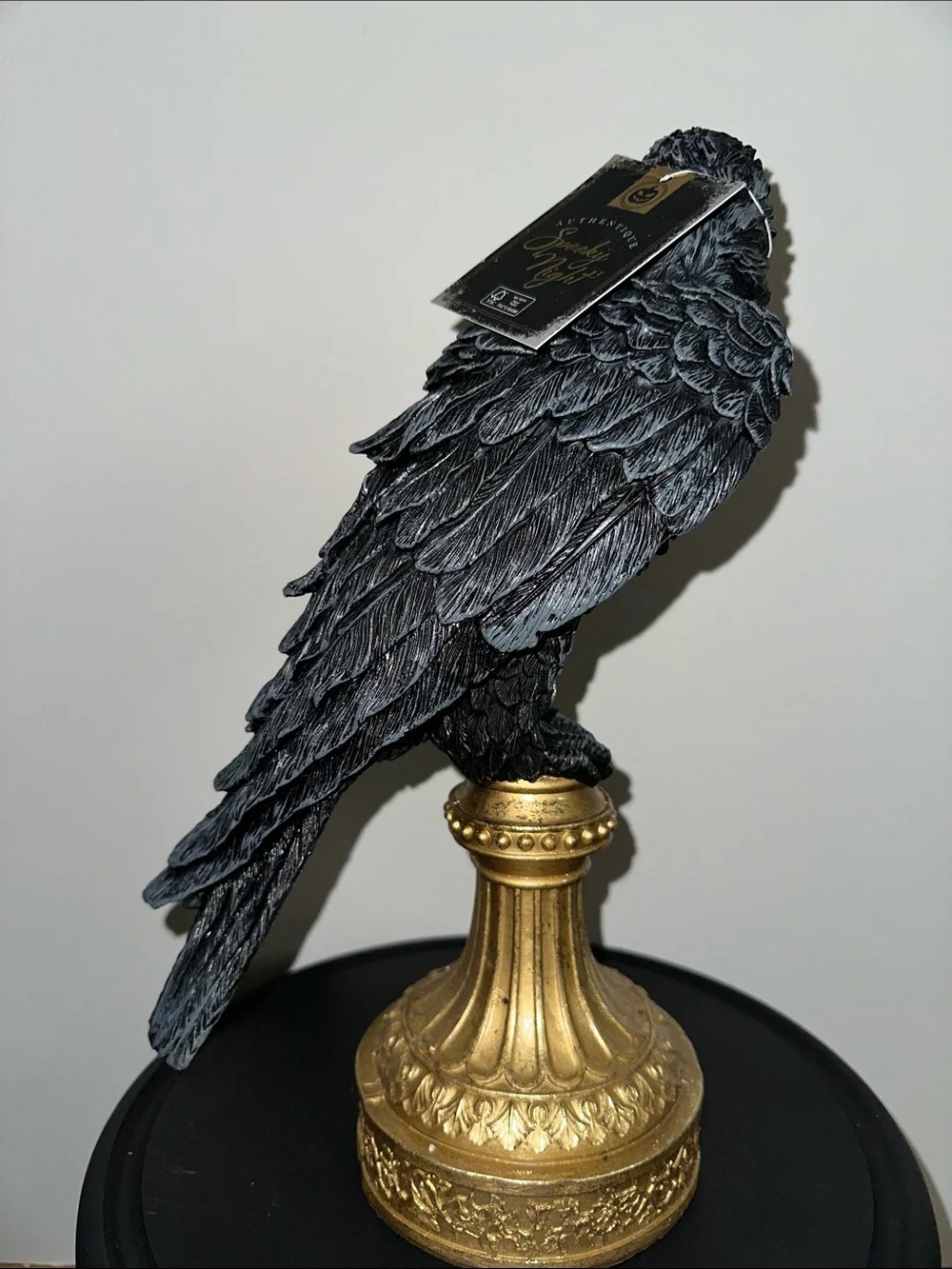 Black Decorative Raven Statue on Gold Pedestal - crow